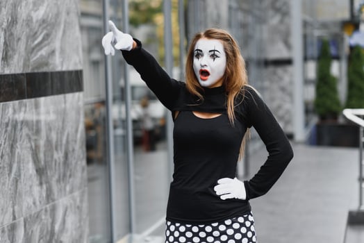 The girl with makeup of the mime. improvisation. mime shows different emotions photo