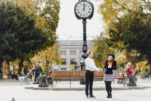 A couple of merry mimes. He hurries on a date. photo