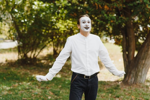young Funny mime shows something. photo