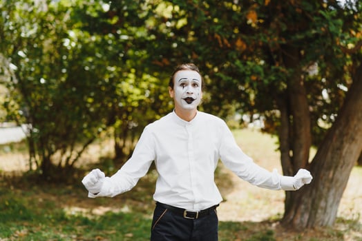 young Funny mime shows something. photo