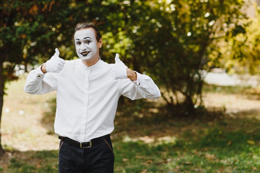 Portrait of a man, artist,clown, MIME. Shows something. Mime actor shows different emotions. photo