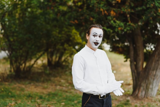 young Funny mime shows something. photo