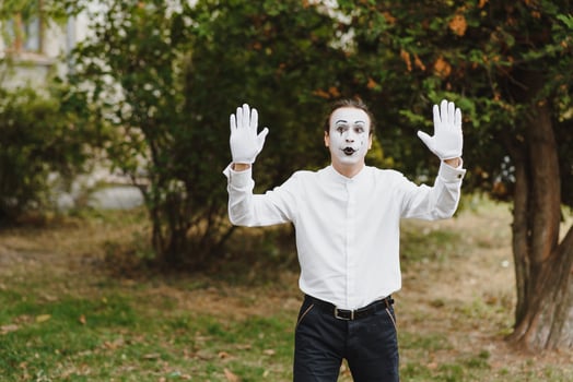 young Funny mime shows something. photo