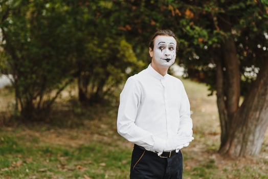 Portrait of a man, artist,clown, MIME. Shows something. Mime actor shows different emotions. photo
