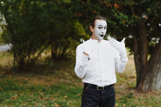 Portrait of a man, artist,clown, MIME. Shows something. Mime actor shows different emotions. photo