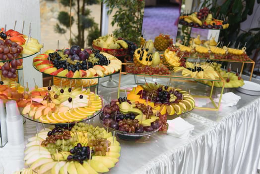 desserts with fruits, mousse, biscuits. Different types of sweet pastries, small colorful sweet cakes, macaron, and other desserts in the sweet buffet. candy bar for birthday photo