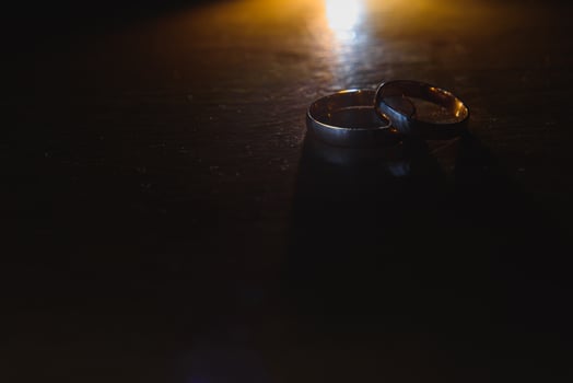 Beautiful wedding golden rings on dark background photo