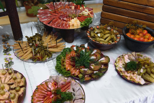 Meat and cheese appetizers. Antipasti and catering platter with different meat and cheese products. photo