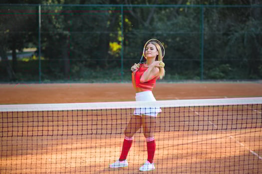 pretty, young female tennis player on the tennis court photo