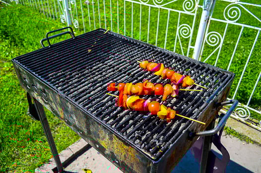 Simple barbecue skewers with meat and vegetables photo