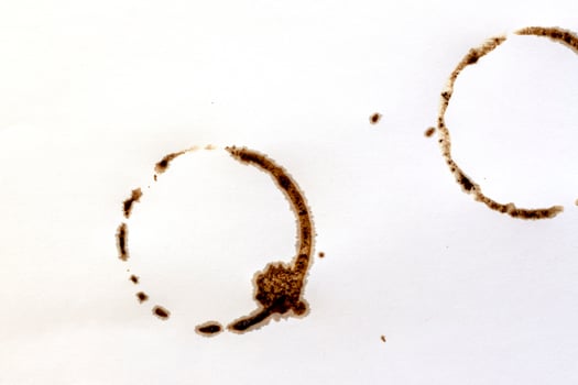 Cup ring splashes and circle drink marks. Brown dirty mug stains. Coffee grunge texture photo