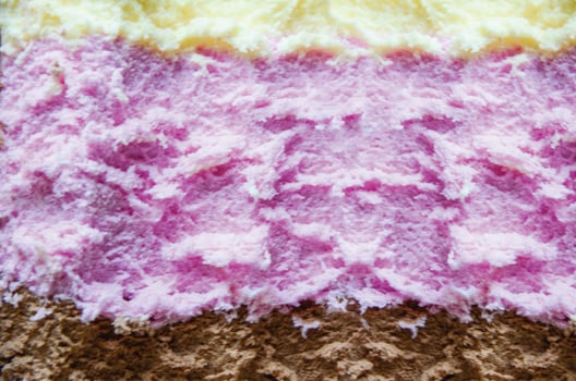 Closeup shot of an Ice cream with three different flavor photo