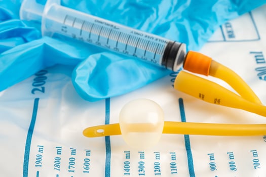 Foley urinary catheter with urine bag for disability or patient in hospital. photo