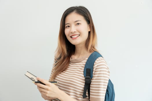 Portrait beautiful Asian woman student. Smile girl happy study. read book in college campus. young female on international Asia University. Education, study, school, learning, exam, continue education photo