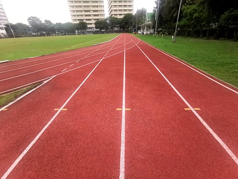 The running track inside a football stadium is usually a circular pathway surrounding the field photo