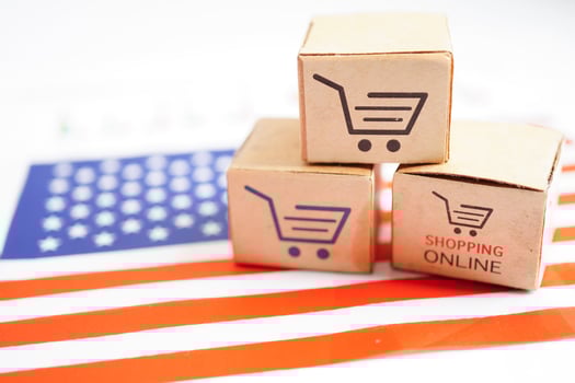 Online shopping, Shopping cart box on USA America flag, import export, finance commerce. photo