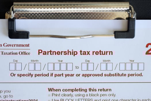 KYIV, UKRAINE - JULY 10, 2024 Australian Partnership Tax Return blank form lies on table of Australian Government taxation office photo