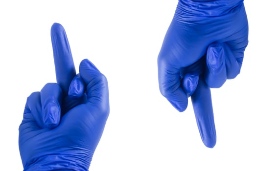 Blue gloved hand showing middle finger isolated on white background. photo