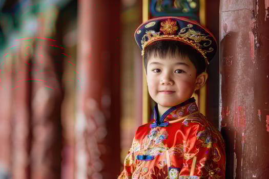 Young boy wearing traditional chinese clothing posing in temple photo