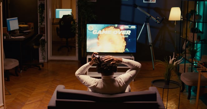 Gamer receiving game over screen, getting his spaceship destroyed in huge explosion while fliying in galaxy and fighting enemies. Player losing science fiction spacecraft singleplayer videogame photo