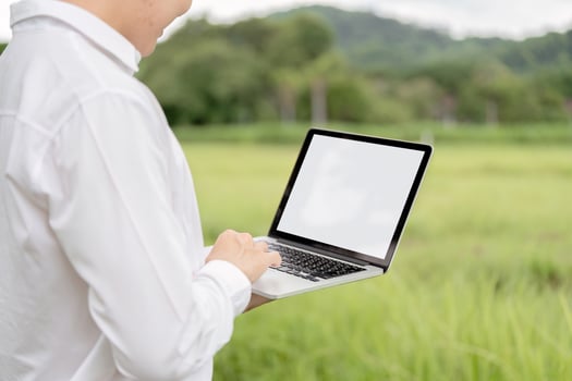 Agricultural Researchers Utilizing Modern Technology in Field for Enhanced Crop Analysis and Data Collection photo