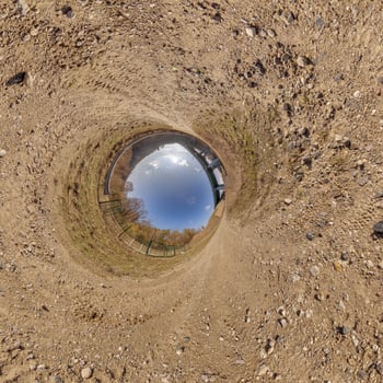 blue hole sphere or globe little planet inside sand or dry ground frame background photo