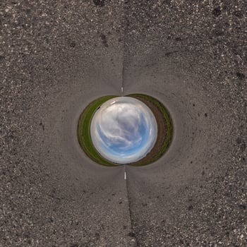 blue hole sphere or globe little planet inside sand or dry ground frame background photo