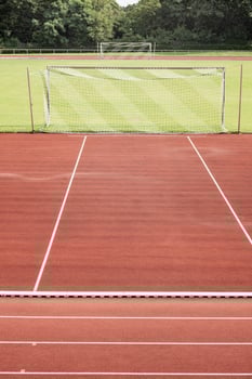 grass football pitch with two goals photo