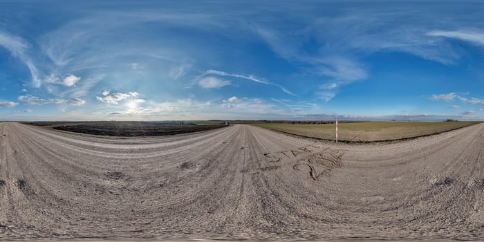 hdri 360 panorama on gravel road among fields with sign 2024 start on sand at evening with clouds in equirectangular full seamless spherical projection, for VR AR virtual reality content photo