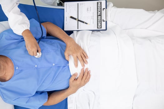 Doctors use stethoscope to listen patient heartbeat to find faults in heart disease. Doctors use stethoscope to listen patient heart rate to gather information diagnose disease and provide treatment. photo