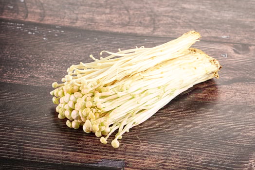 Tasty raw enoki mushroom heap photo