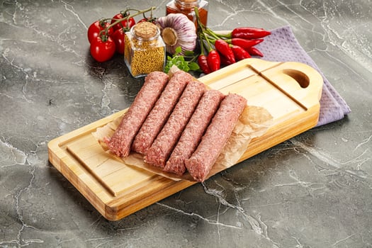 Raw beef kebab sausage for grill photo