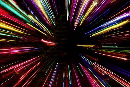 Vibrant Neon Light Traces Against Dark Background photo