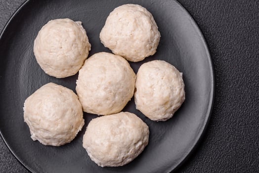 Delicious healthy steamed chicken cutlets or minced meatballs photo