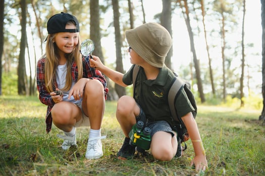 kids in green forest playing,concept of kids vacations and travel photo