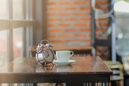 soft Focus,The clock placed on a wooden table by the window is an alarm clock that can be used to set an appointment for reminders.The idea of using an alarm clock as an alarm before the appointment photo