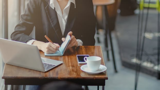 A young self-employed businesswoman and real estate investor, working in a home office and shopping online via the website. photo