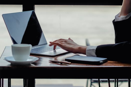 A young self-employed businesswoman and real estate investor, working in a home office and shopping online via the website. photo