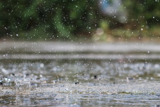 The rain was falling on the roadway due to a precipitation that was forming after the depression hit Thailand, causing heavy rains in some areas and flooding the road surface. photo