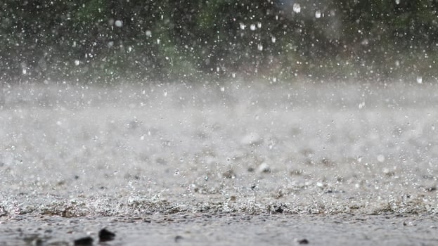 The rain was falling on the roadway due to a precipitation that was forming after the depression hit Thailand, causing heavy rains in some areas and flooding the road surface. photo