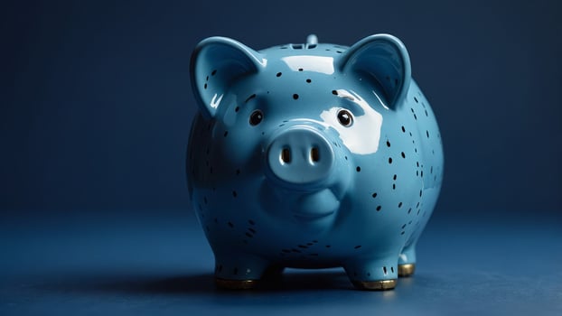 blue piggy piggy bank on a blue background. photo