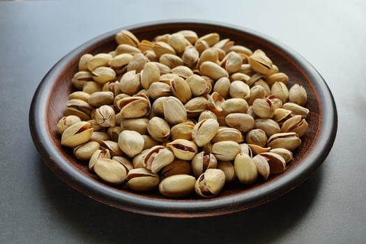 Pistachio nuts. Pistachios in a plate. photo