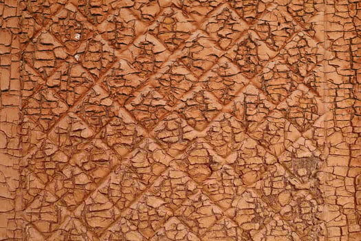 The terracotta surface is old and cracked. photo