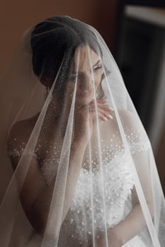 A woman is wearing a veil that is covering her face photo