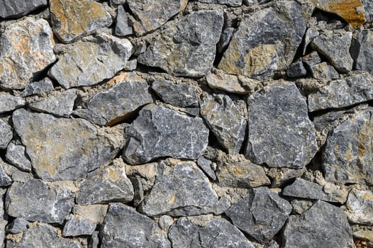 Old weathered stone wall of medieval fortress brick horizontal grunge background photo