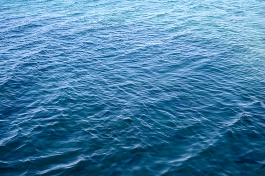 Cyprus. Crystal clear blue water of the Mediterranean Sea on the beach photo