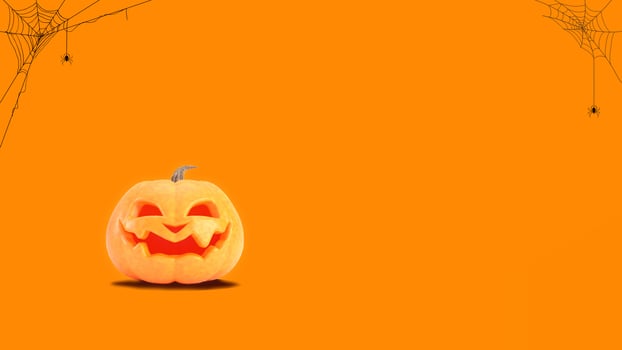 Halloween pumpkin smiles on orange background with spider web and copy space. Funny Jack o lantern Halloween background. 3d rendering. photo