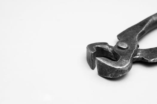 Tools for pulling nails - old metal pliers. photo