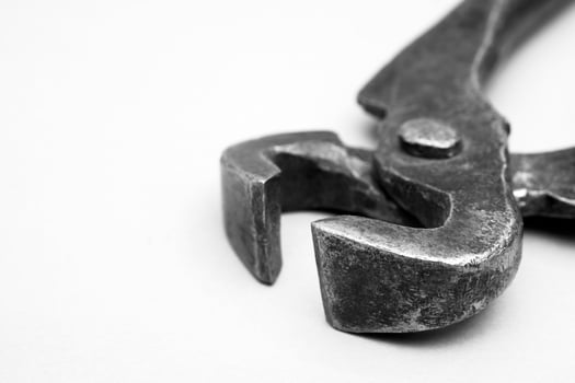 Tools for pulling nails - old metal pliers. photo