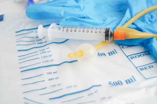 Foley catheter and urine drainage bag collect urine for disability or patient in hospital. photo